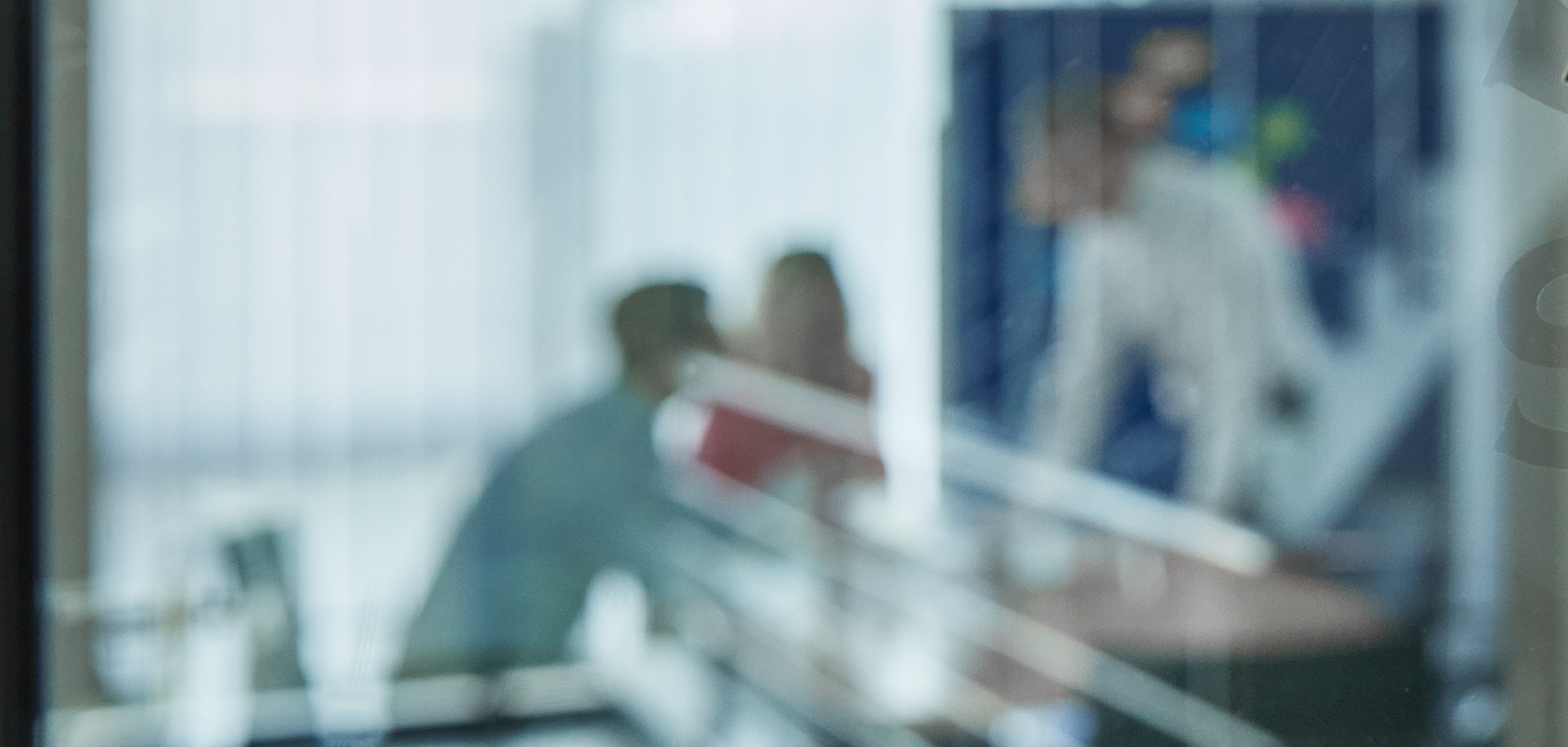 Image working employees trough glass